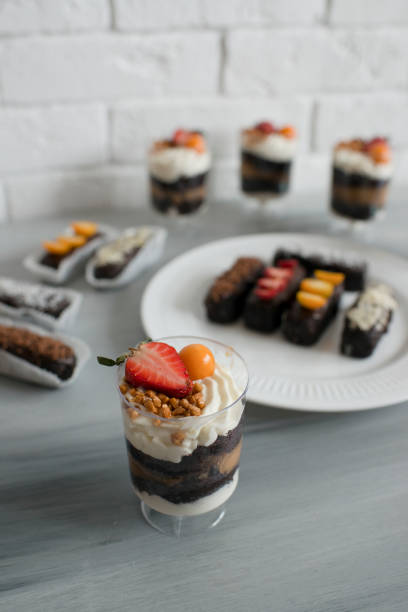 istock Delicious pastries with chocolate icing and berries on the table. 1426477872