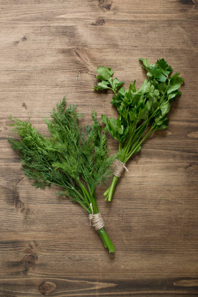 istock Fresh herbs on a wooden table 1426479120