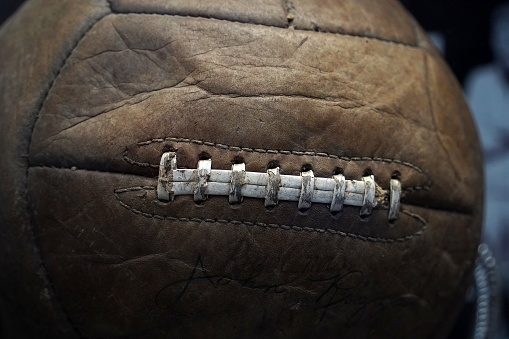 old vintage soccer ball made of leather close up detail
