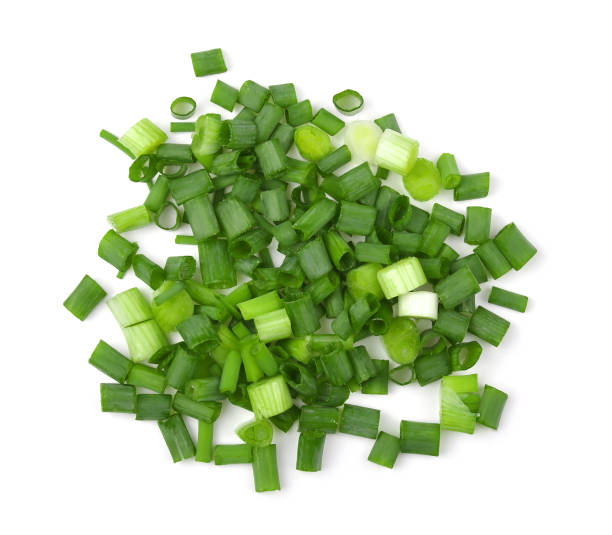 istock Spring chopped onions leaves. Isolate on a white background, top view. 1426480684