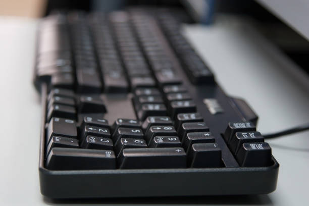 istock Closeup of black Thai and English computer keyboard 1426481110