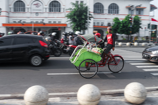 Yogyakarta, Indonesia - February 14, 2020 : Traditional Rickshaw at Malioboro street in Yogyakarta city