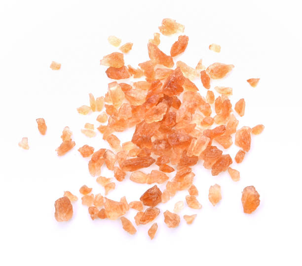 istock Chrystal Sugar,Brown candy crystals sugar on white background. Top view 1426482033