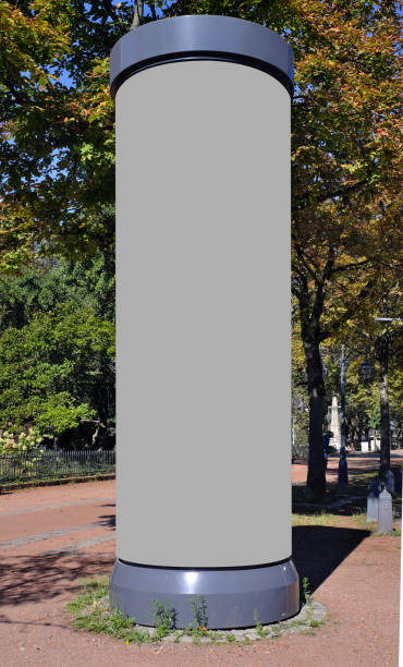 Empty advertising pillar in a city with free copy space, promotion mock up. Blank advertising panels. empty advertising pillar in a city with free copy space, promotion mockup advertising column stock pictures, royalty-free photos & images