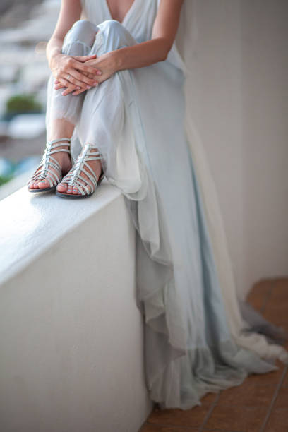 Engagement ring on bride's finger during wedding preparations.