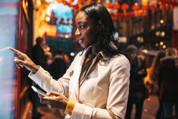 istock Woman Checking Menu Outside a restaurant in London Chinatown 1426496801