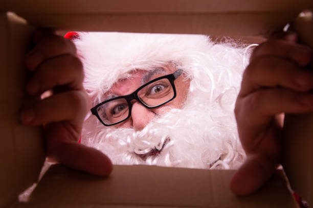 istock Delivery. Funny Santa Claus with empty boxes. 1426499445