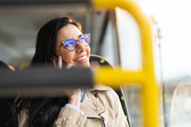 istock Woman traveling by bus and using smart phone 1426499451