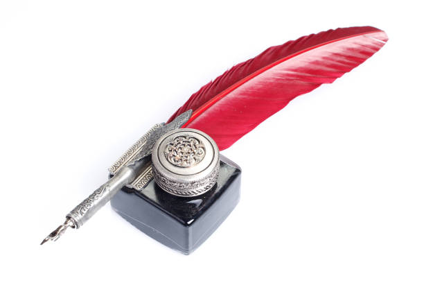 istock Old red fountain pen with inkwell on white background 1426503331