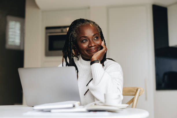 istock Cheerful senior woman working from home 1426505317