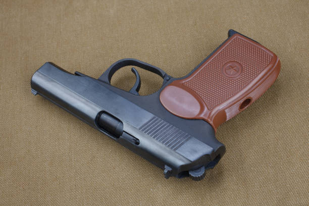 istock 9mm soviet handgun on USSR khaki uniform Soviet–Afghan War (1979-1989) era 1426505463