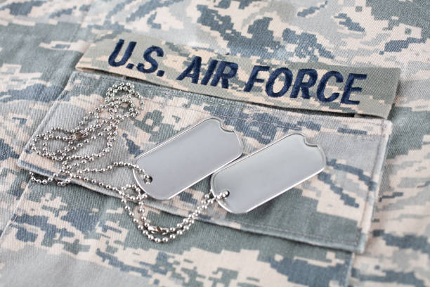 istock US AIR FORCE branch tape and dog tags on digital tiger-stripe pattern Airman Battle Uniform (ABU) 1426505657