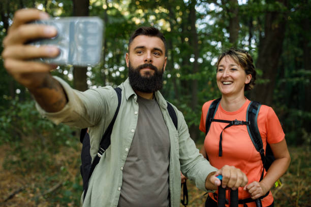 istock Young man taking selfies with his mother while on the forest hike 1426513274