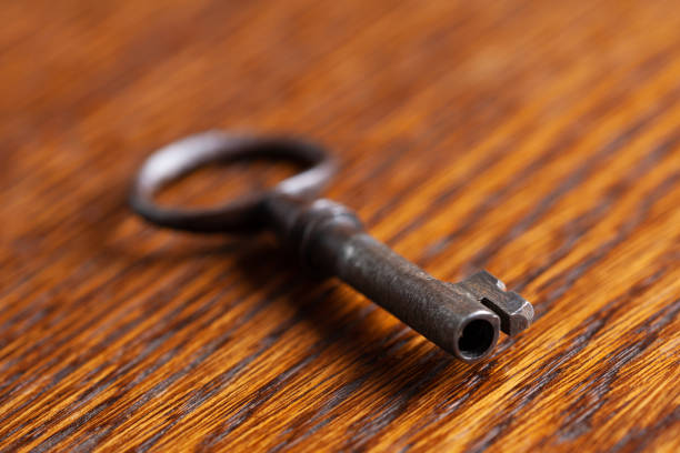 istock vintage old key on wooden table 1426518113