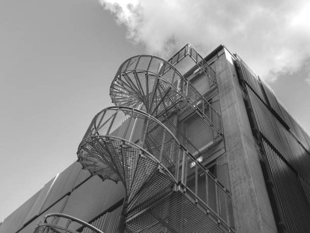 istock Low angle view of building with spiral staircase on the outside 1426522518