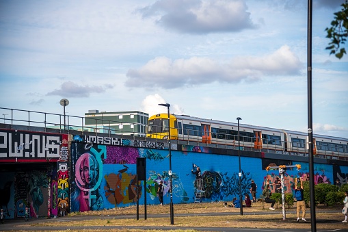 London, United Kingdom - June 29, 2022: Overground and street artists in Brick Lane