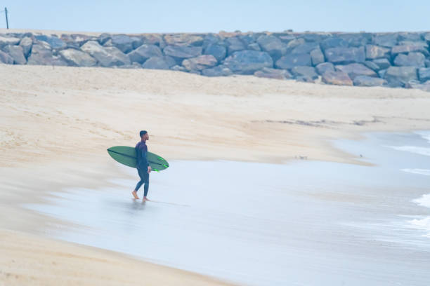 istock Brazilian surfer looking at the ocean 1426536119