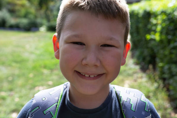 istock Little 7 years schoolboy going to school 1426537109