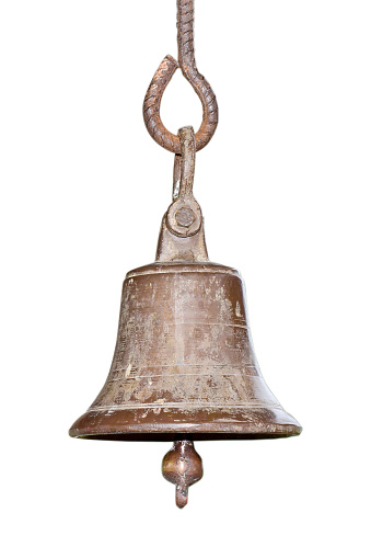 Ringing the old bell in the temple, golden metal old bell isolated on white background