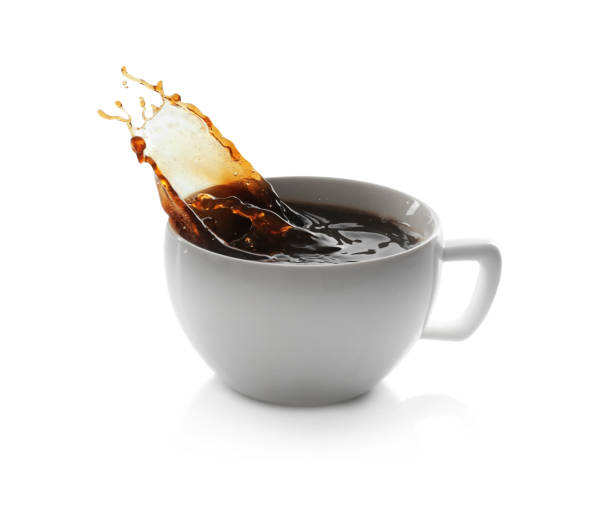 istock Coffee splashing out of cup on white background 1426541025