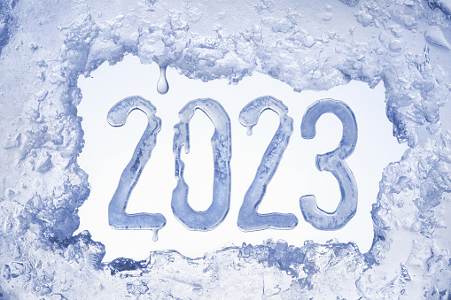 New year 2023 in frame of blue ice