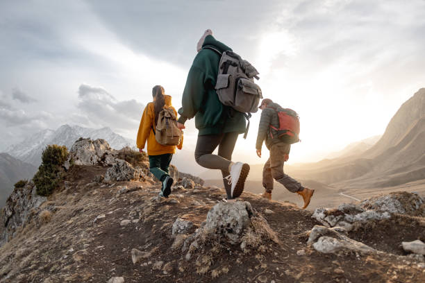 istock Group of young people walk in mountains 1426541186