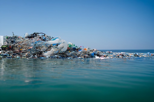floating garbage on the sea , dirty dump in ocean