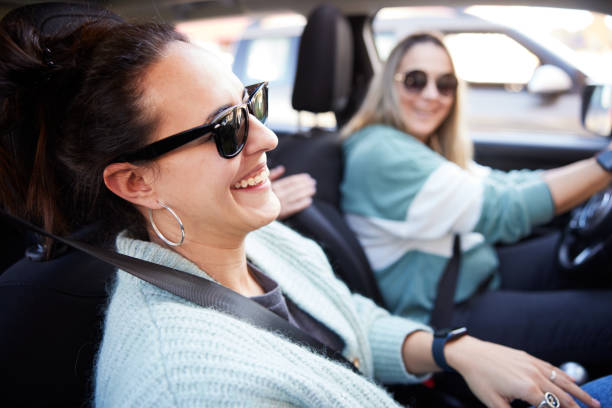 istock A couple is laughing and having fun on a road trip. 1426543553