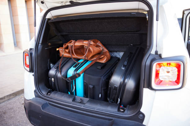 istock Suitcases loaded in a car's trunk. 1426544081