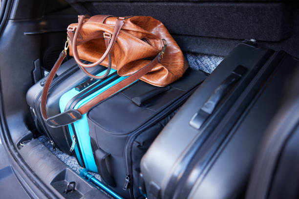 istock Suitcases loaded in a car's trunk. 1426544085