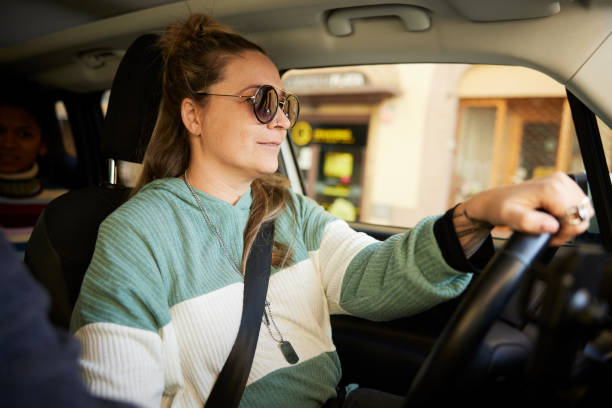 istock A middle-aged woman is driving a car. 1426544195
