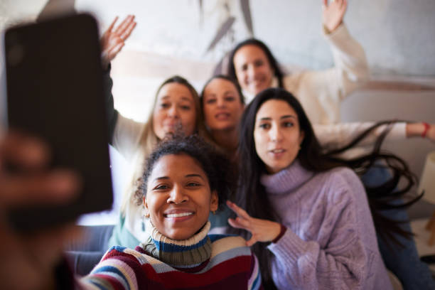 istock Friends in a hotel taking a  group selfie. 1426544399