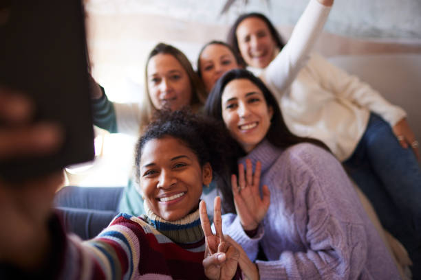 istock Friends in an apartment taking a  group selfie. 1426544419