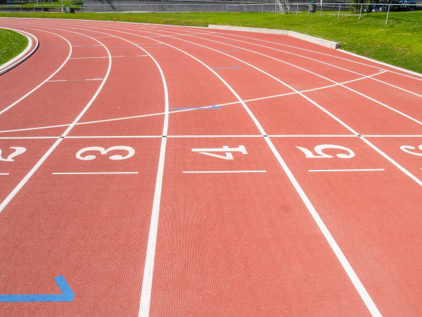 istock Numbered lanes on red running track 1426544467