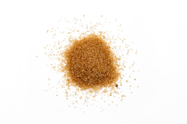 istock pile of cane sugar isolated on white background 1426545340