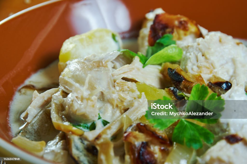 Caucasian  Ossetian Chicken with Sour Cream Ossetian Chicken with Sour Cream, Caucasian  cuisine, Traditional assorted dishes, Top view. Caucasus Stock Photo