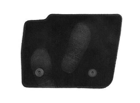 Black car floor carpet with footprints isolated on white, top view