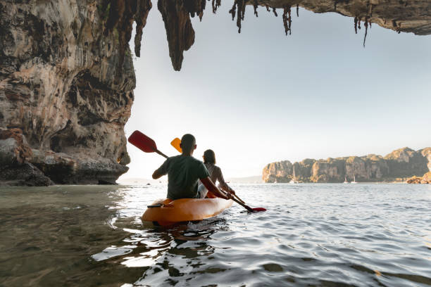 istock Young couple kayaking at tropical sea bay 1426548846