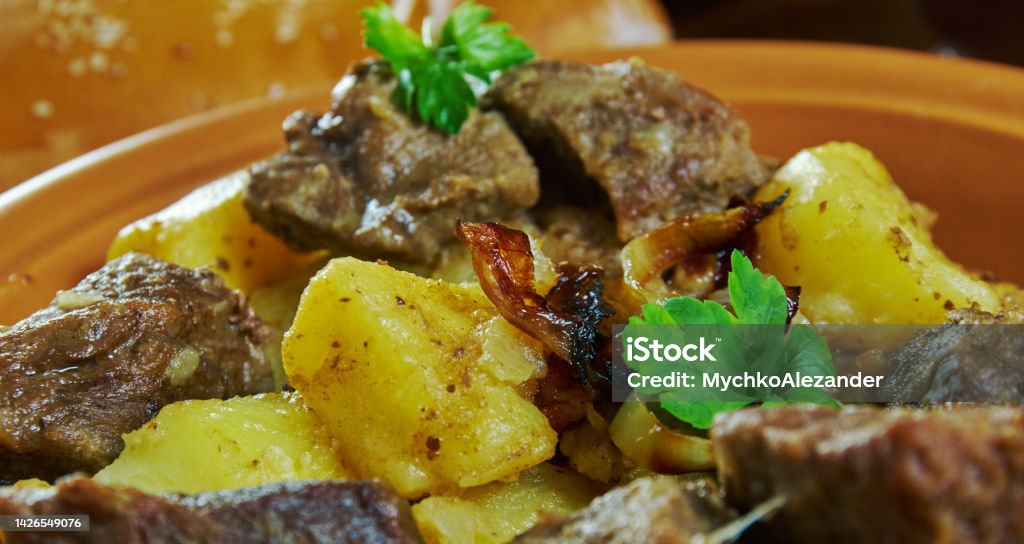 Caucasian  Shtur  lyvza Shtur  lyvza, Ossetian beef stew with vegetables.  Caucasian  cuisine, Traditional assorted dishes, Top view. Beef Stock Photo
