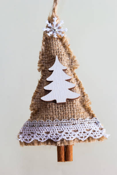 istock handmade Christmas tree toy, Christmas toy herringbone tree, burlap 1426549409