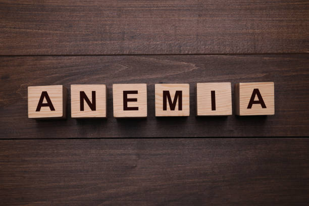 istock Word Anemia made with cubes on wooden table, flat lay 1426549555