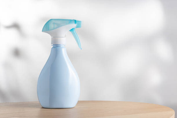 Blue air freshener spray bottle on a simple background