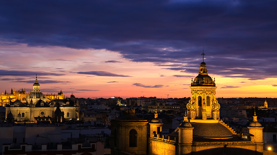 The sunset view of Seville Cathedral (Catedral de Santa Maria de la Sede de Sevilla) view from the observation platformcity skyline with sunset view  Seville Cathedral ,Spain