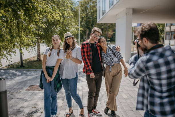 istock Friends taking photos in university campus 1426557139