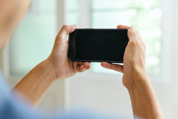 istock Adult using bluetooth blood pressure monitor. 1426557344