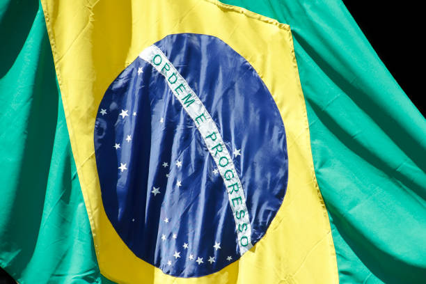 istock Brazilian flag fluttering from a flag pole - Brazil 1426564142