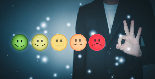 istock Customer service evaluation and satisfaction. Smile rating to feedback survey concept. Man wearing black suit and Hand making ok sign. 1426564147