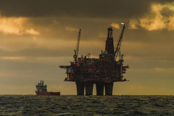 Industrial oil rig offshore platform construction site on the North Seacoast. The fossil fuel is in a crisis, and renewable energy is the future
