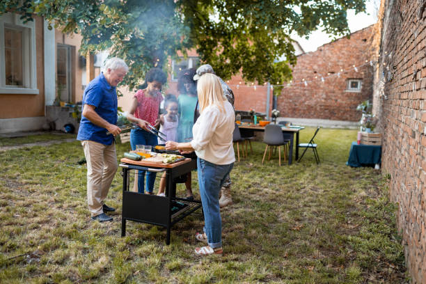 istock Multi-generation family grilling together at a barbecue party 1426565336