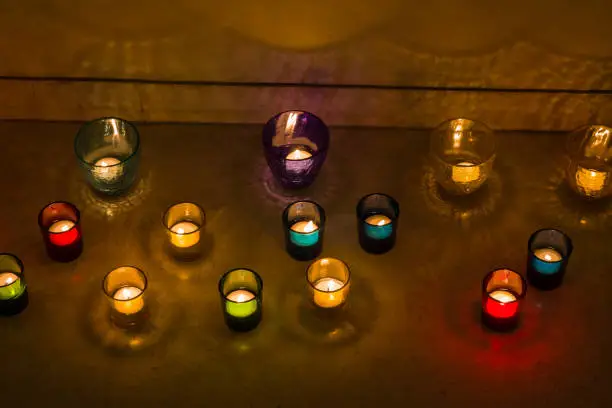 Photo of Closeup view of Diwali or Deepavali decoration with glass candle holders with tea lights or Diya.